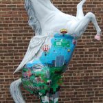 A horse statue painted by 3d pop artist Charles Fazzino for Horsin' Around Stamford
