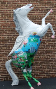 A horse statue painted by 3d pop artist Charles Fazzino for Horsin' Around Stamford