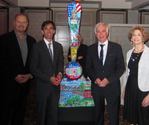 Image of Charles Fazzino, New Rochelle Mayor Noam Bramson, La Rochelle France Mayor Bono, Anniversary Gala Chair Marianne Sussman all standing next to the New Rochelle Fazzino Installation