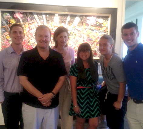 Charles Fazzino posing with the Iona College Team Fazzino members: Brandon Crane, Reed Kochanek, and Cassie Moniodes.