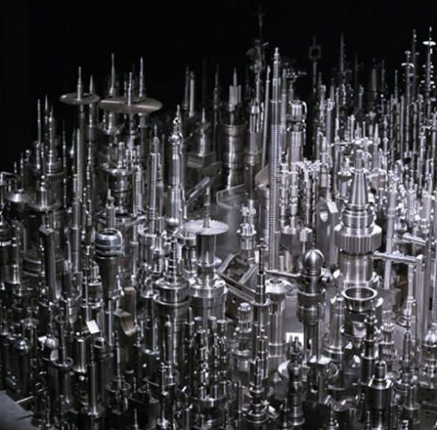 Close up Image of Chu Enoki's 3D steel sculpture of a city skyline
