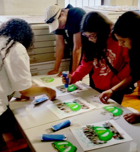 A group of people create their own Fazzino art at the studio tour during Arts Fest