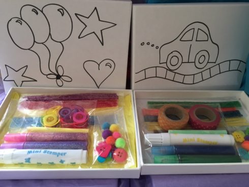 Craft on Wheels art kit for children with special needs including line drawings of balloons, stars and a car and colorful markers