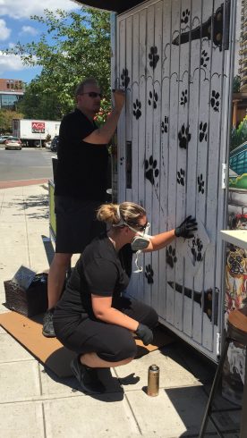 Charles and Heather Fazzino working on their latest pop-art piece, Downtown Dogs in Stamford