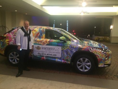 Fazzino standing in front of the 3d pop art wrapped Lexus for the 2016 Ft. Lauderdale Winterfest Boat Parade