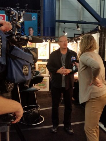 Charles Fazzino being interviewed at the NFL experience for Super Bowl 51