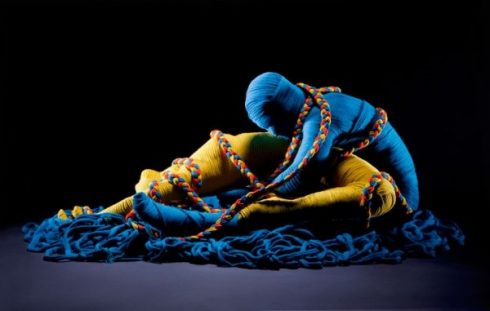 Eric Ravelo, yarn artist, two blue and yellow bodies 