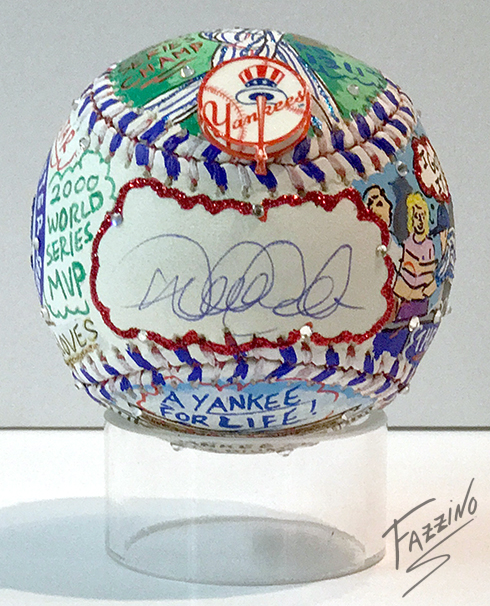 One side of the baseball has a place for a signature, in this case Derek Jeter