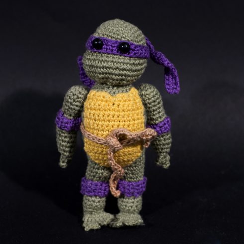 Purple and grey crocheted ninja turtle with a yellow shell and a purple mask | Christina's Crocheted Characters