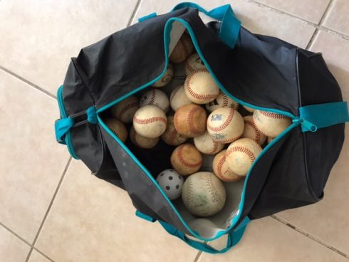 Black bag full of old baseballs - Kids Need More Art and Charles Fazzino All Star Ball Star contest