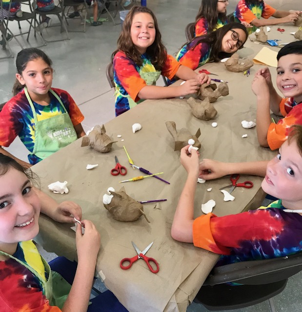 Kids Need More Art at Pine Jog Environmental Science create Pufferfish out of recycled baseballs by using paper mache and model magic
