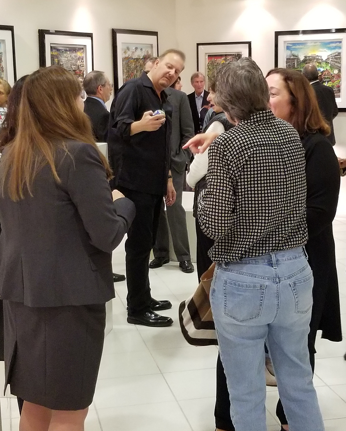 Charles Fazzino holding one of his 3D Pop Art MLB baseballs at the opening reception of "The 3D World of Fazzino" at the MAC Gallery in New Rochelle 