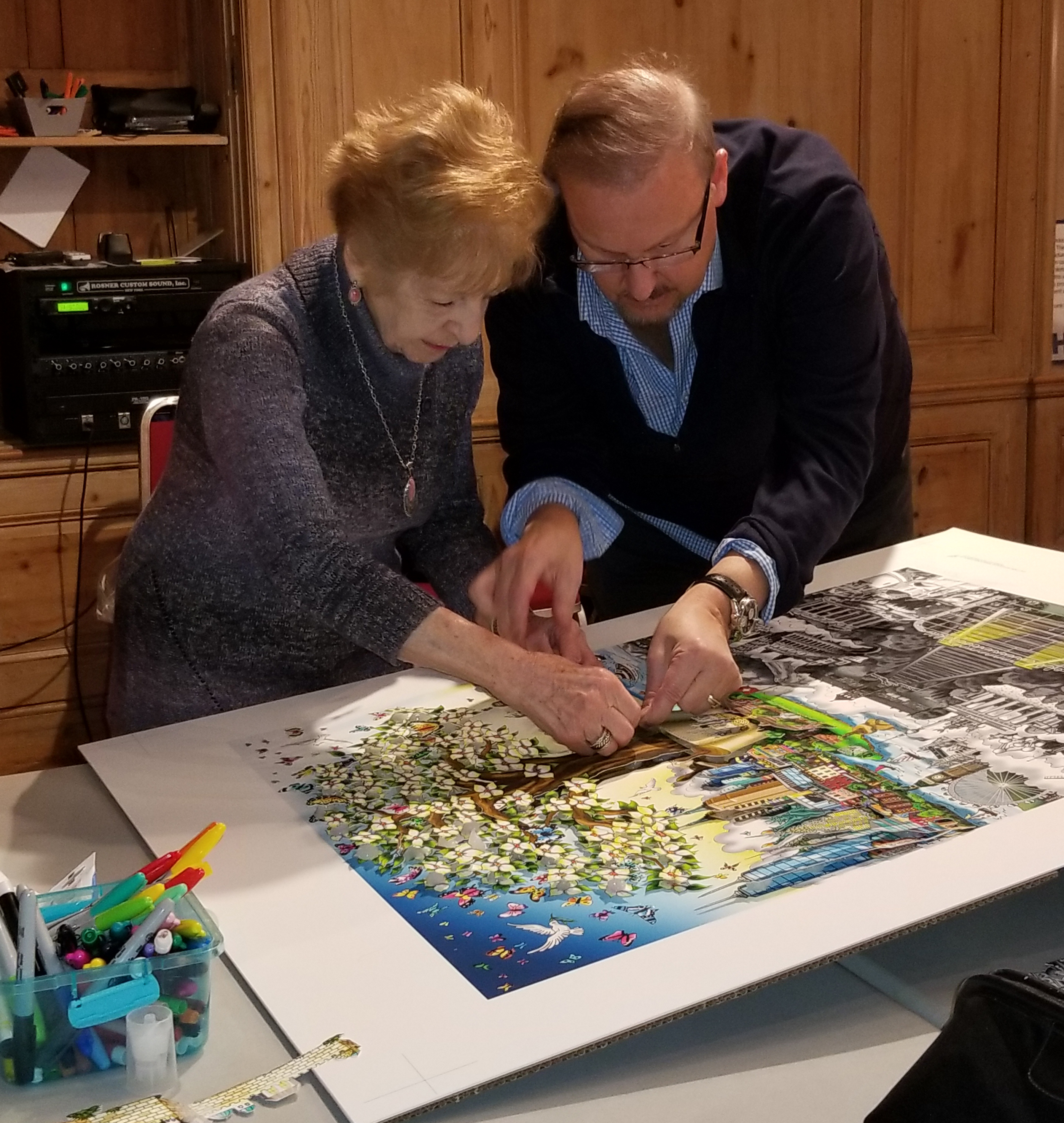 Charles Fazzino and Holocaust survivor work on recreating 3d pop art piece "After the Darkness."