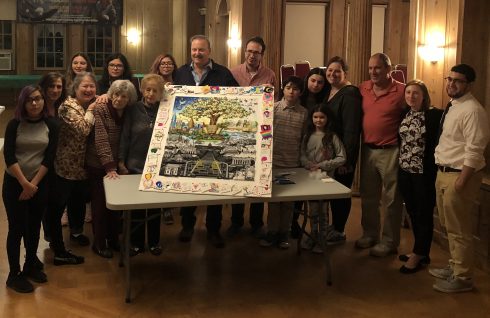 Charles Fazzino, kids and holocaust survivors posing in front of their recreation of "After the Darkness" 3D pop art piece.