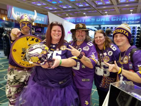 Family of five dressed head to toe in vikings gear at the Super Bowl Experience in Minneapolis 