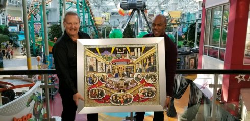 Charles Fazzino presented Entertainment Tonight Host Kevin Frazier with an original painting commemorating the shows long history. The segment was filmed during Super Bowl week at the NFL Super Bowl Media Center at the Mall of America