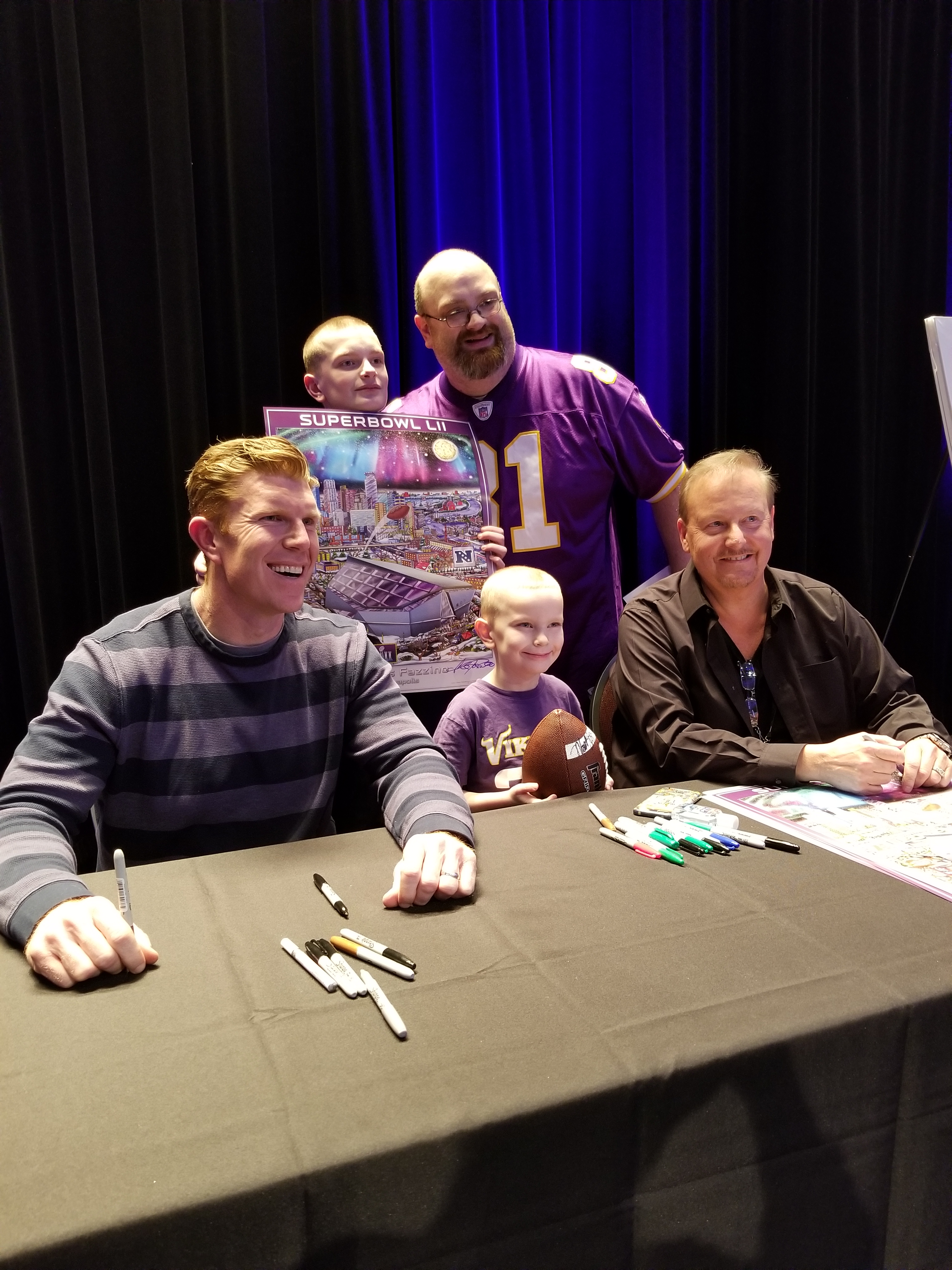 Charles Fazzino signing with NFL Hall-of-Famer Matt Birk at The Super Bowl Experience