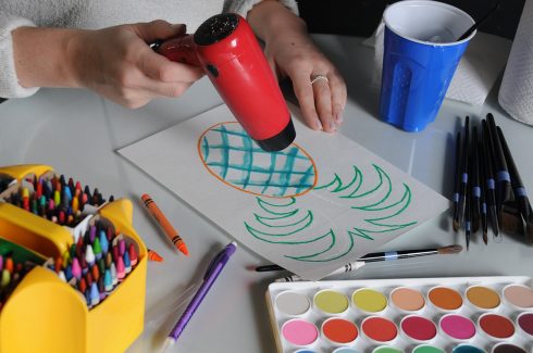 Using a hairdryer to dry watercolor paint to experiment with layering