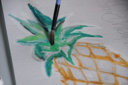 Coloring the leaves of a pineapple with wet on wet watercolor techniques