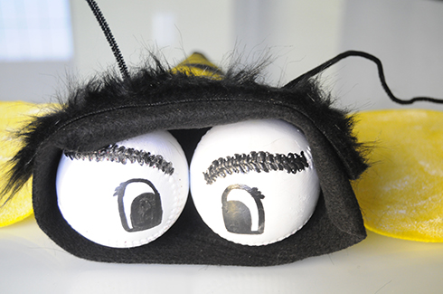 Two baseball are used to create eyes on a bee