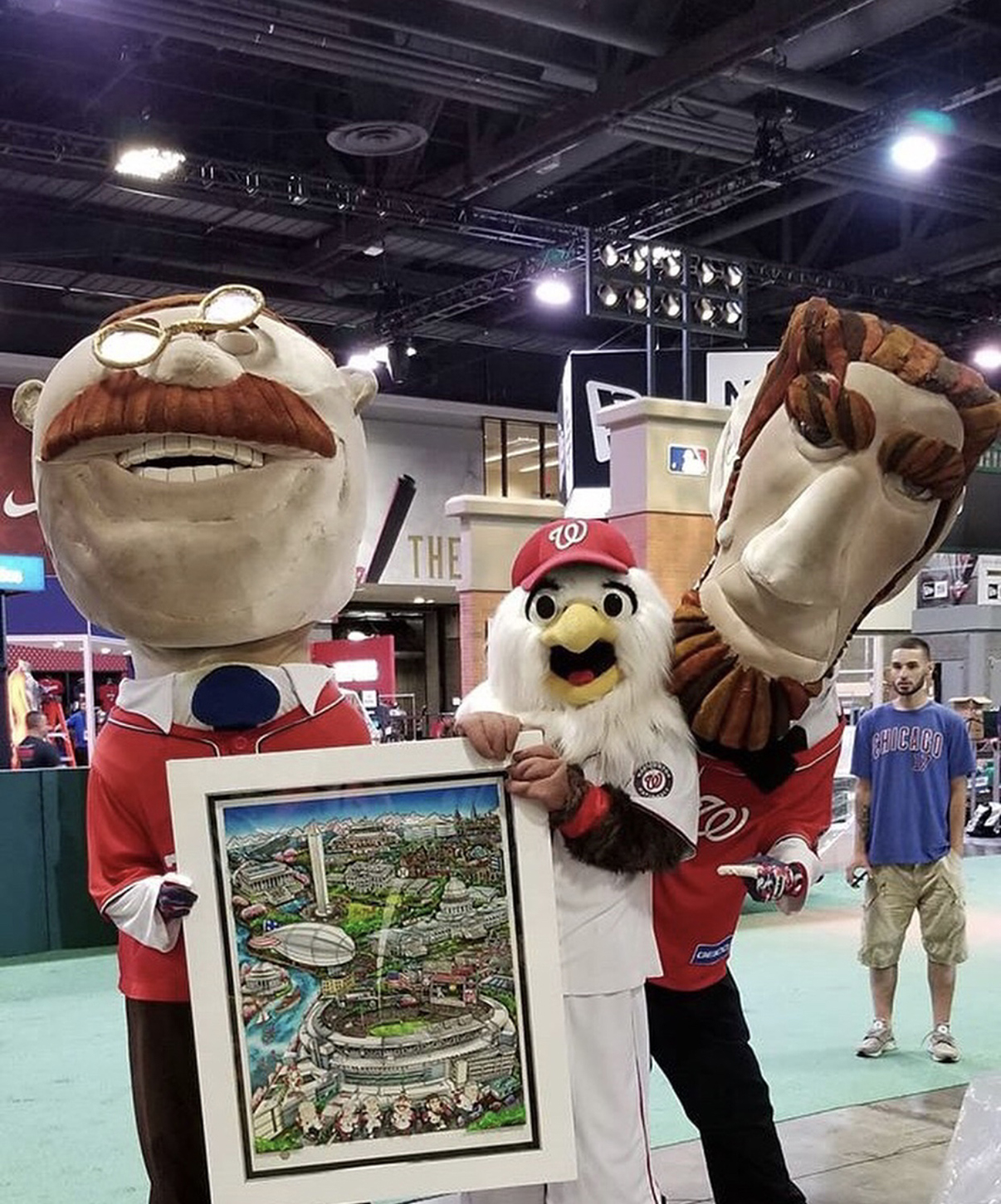 Team mascots holding up Fazzino's MLB 2018 All Star Baseball poster at Fan Fest