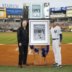 Charles Fazzino presents a retirement gift to NY Yankee legend Derek Jeter on the field at Yankee Stadium