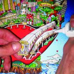 hand glueing a subway train car to a 3d pop art peice done by Charles Fazzino