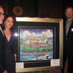 Gloria and Emilio Estefan stand with Charles Fazzino and his original painting for the Ellis Island Medal of Honor Awards