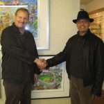 Reggie Jackson and Charles Fazzino shaking hands at the artists studio when the Yankee legend stopped by for a visit.