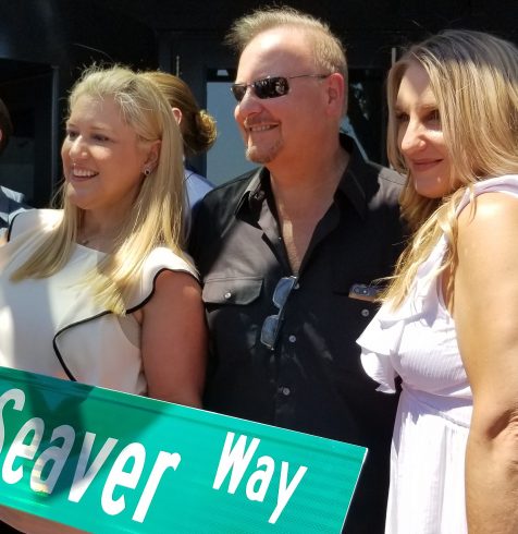 Charles Fazzino with Annie and Sarah Seaver holding the Seaver Way sign