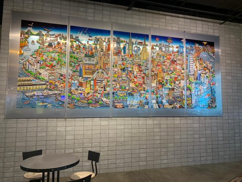 Close up of a colorful Charles Fazzino mural in the mall food court. 