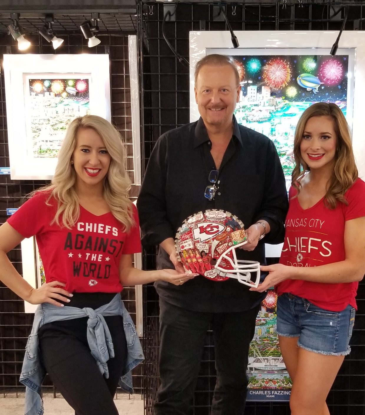 Kansas City Chiefs Cheerleaders next to Fazzino with the Kansas City football helmet.