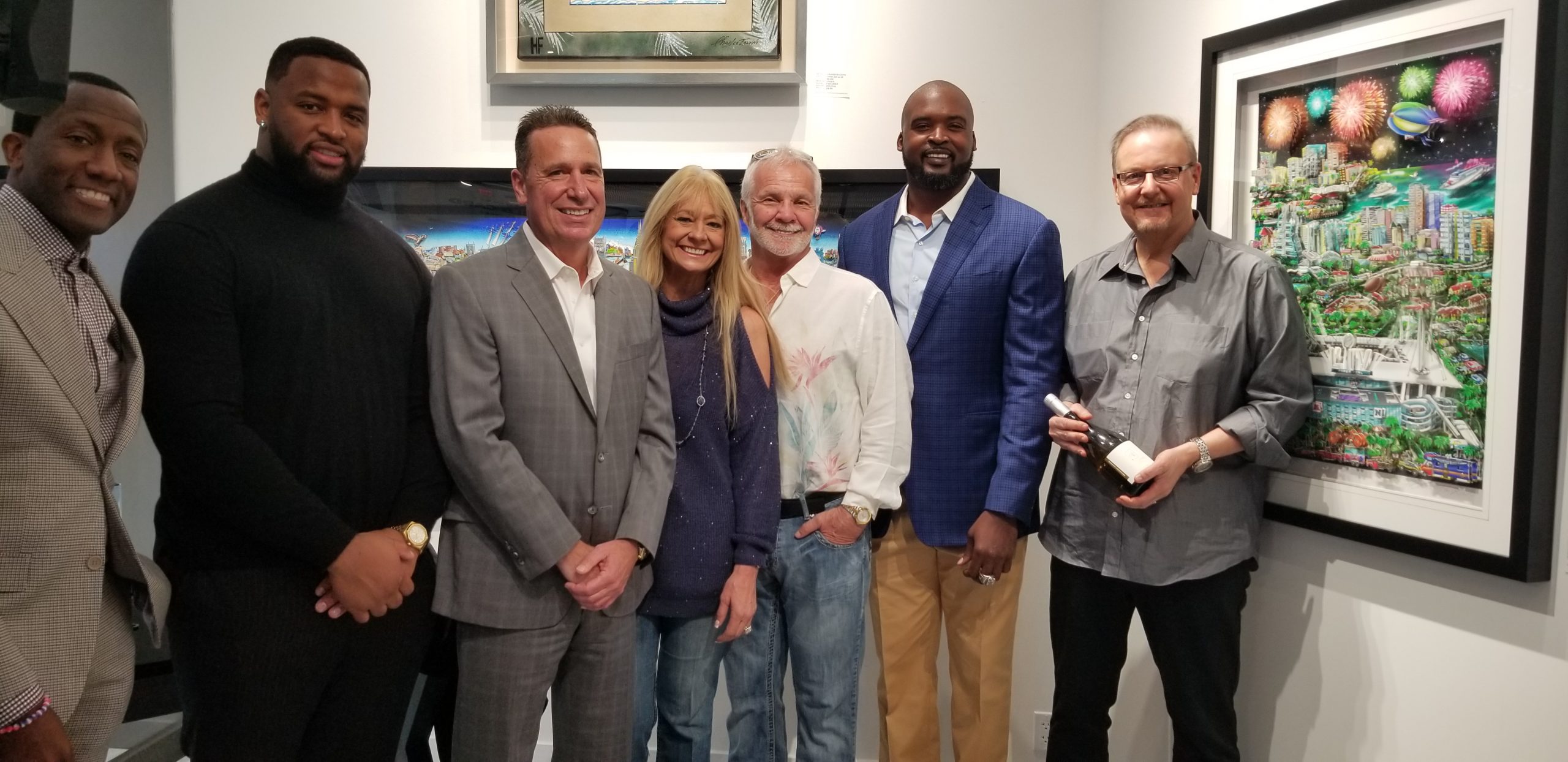 Super Bowl art unveiling at Wentworth Gallery in the Hard Rock Hotel & Casino in Hollywood, FL. Attendees included (from left to right): Donovan Campbell, Miami Dolphin Davon Godchaux, President of the Hard Rock Hotel & Casino Bo Guidry, Winterfest CEO and President Lisa Scott-Founds, Bravo Television Personality Captain Lee, Former NY Giant Mathias Kiwanuka, and Charles Fazzino