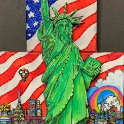 close up pop art piece of green statue of liberty and american flag in background - Charles Fazzino