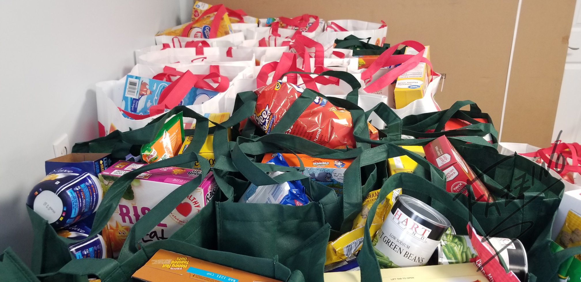 reusable bags full of groceries for thanksgiving food drive