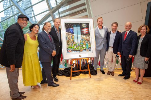 Charles Fazzino pictured with his pop artwork piece memorializing 9/11 Twin Towers titled 9/11: A Time for Remembrance, Twenty Years Later. Standing with Bernie Williams, Anthoula Katsimatides, Joseph Esposito, Charles Fazzino, Pete Alonso, Jeff Wilpon, Salvatore Cassano, Alice Greenwald