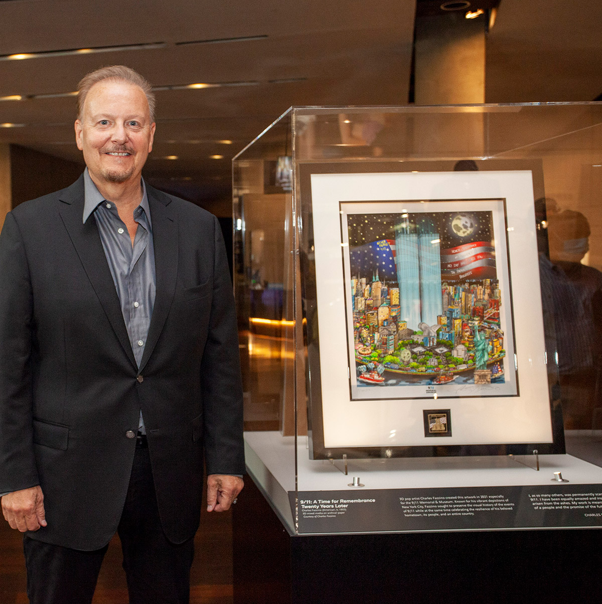 Charles Fazzino standing next to his original memorial piece titled " 9/11: A Time for Remembrance, Twenty Years Later"