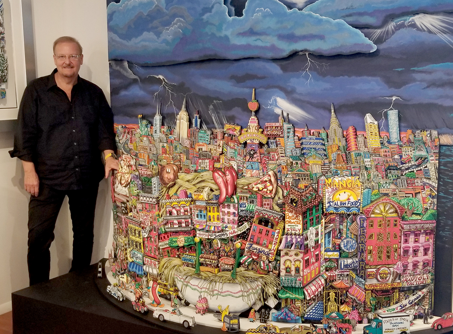 Fazzino standing next to very large artwork he recently created