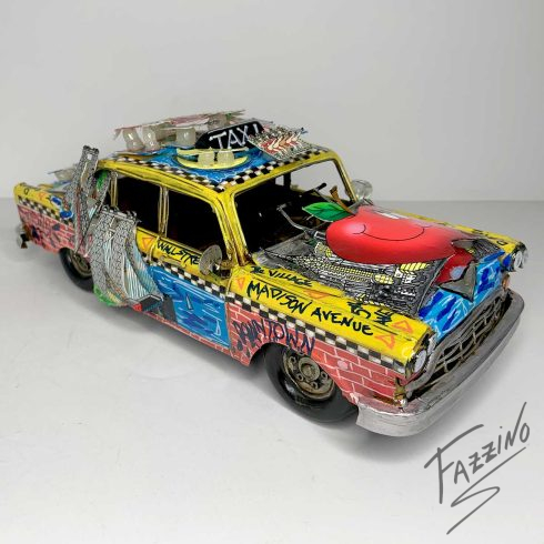 yellow taxi cab sculpture featuring NYC landmarks