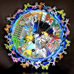 Round blue art piece with butterflies surrounding the border and several world icons in the middle, including the statue of liberty, a pyramid, and the Eiffel tower
