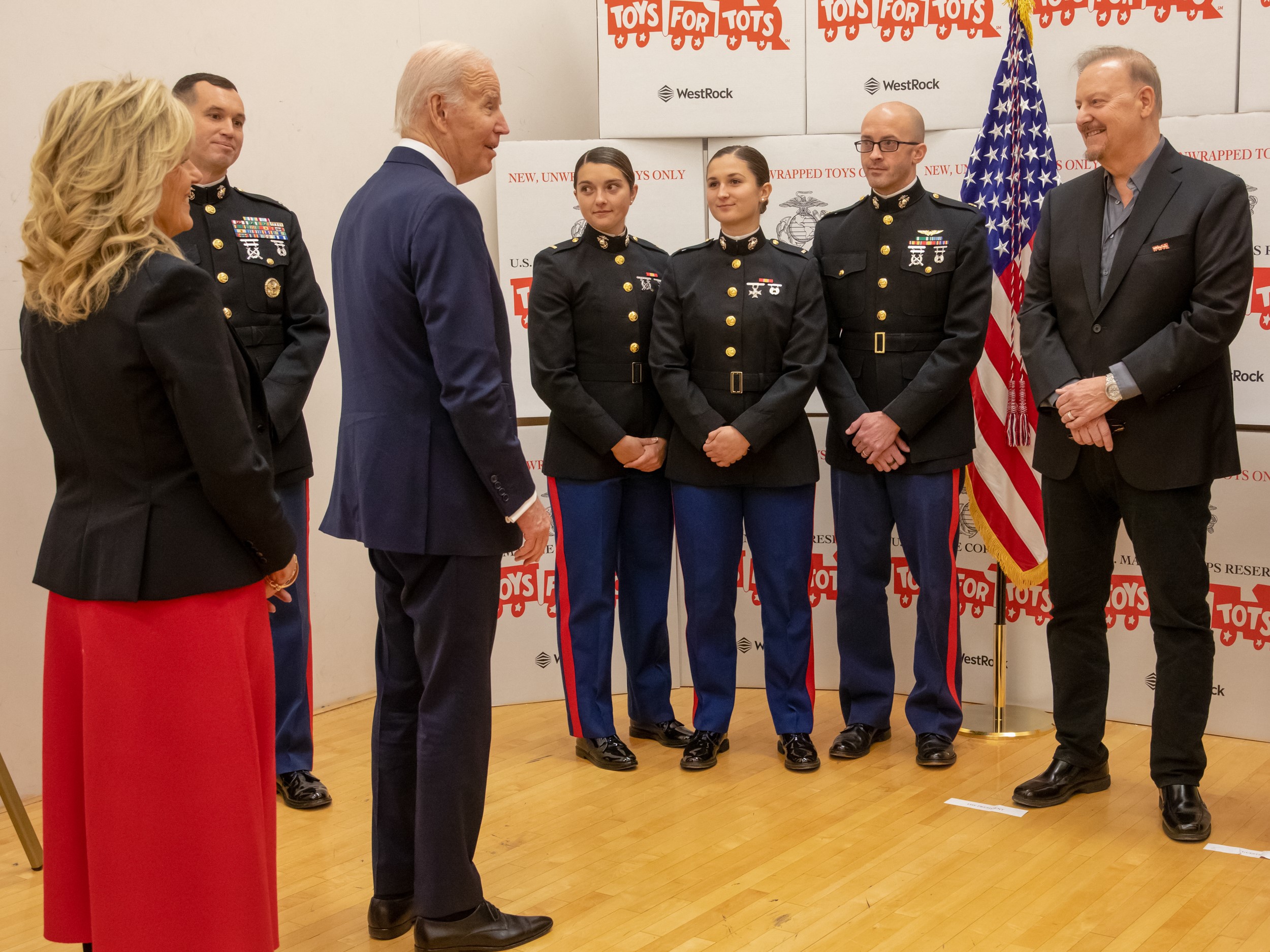Fazzino passes toys for tots gifts to the First Lady