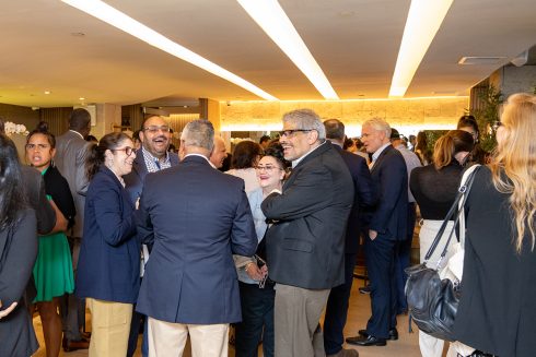 A group of people gather for the Team of Heroes gala kickoff party 