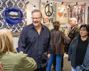 Charles smiles at one of the visitors in the Fazzino studio during ArtsFest